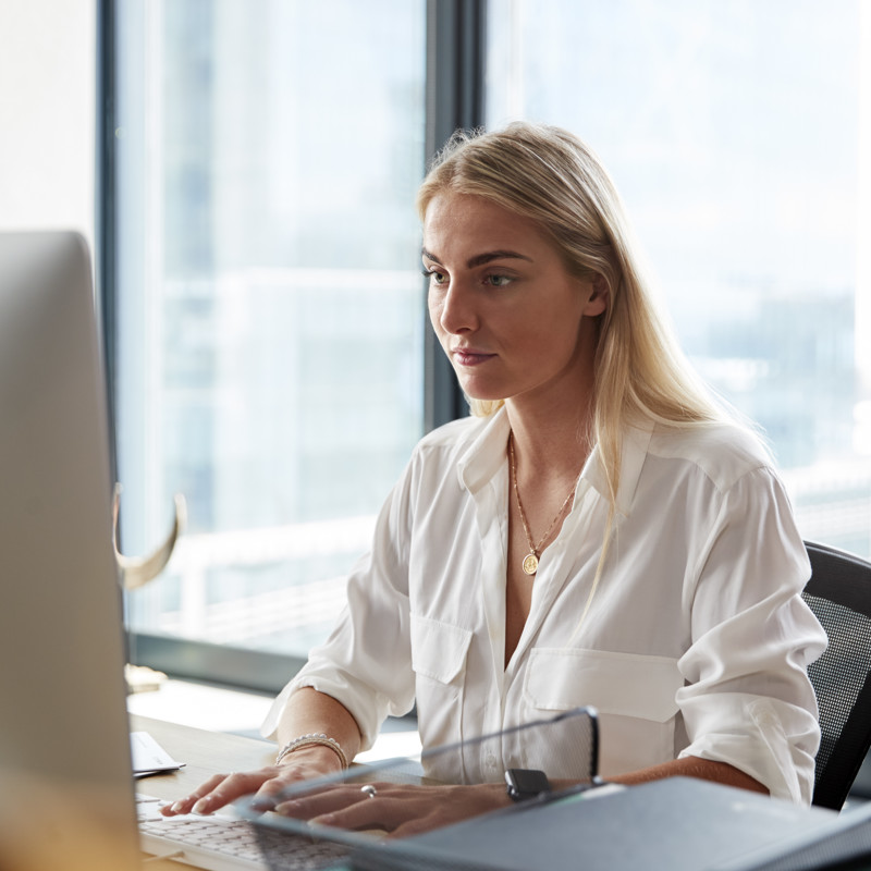 Young White Blonde Woman Sitting Desk Working Computer Creative Office Close Up